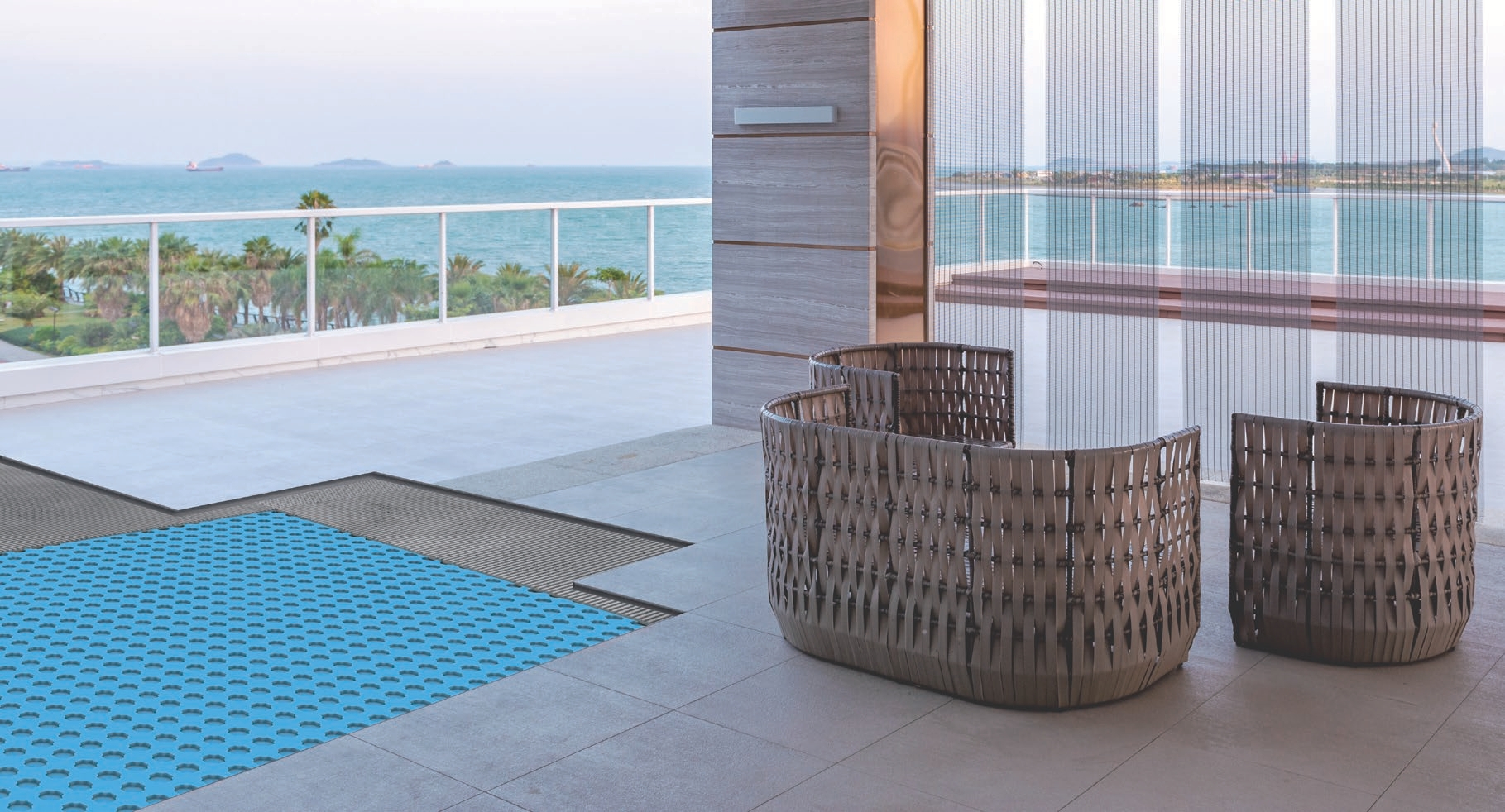 Oceanview rooftop terrace with a blue decoupling mat installed across the deck before tile over a drainage assembly