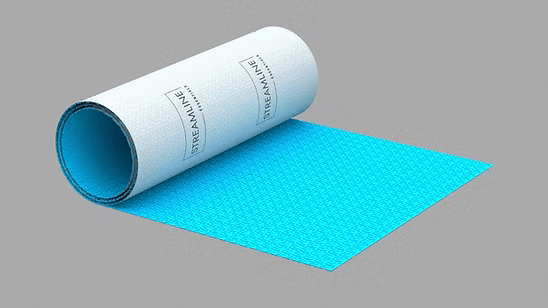 Streamline Essentials decoupling uncoupling mat partly unrolled, showing the blue waffle-textured surface